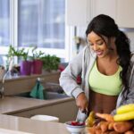 A woman in the kitchen preparing healthy food